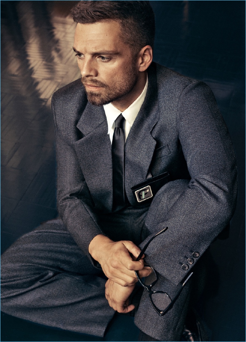Donning a sharply tailored suit, Sebastian Stan wears Prada.