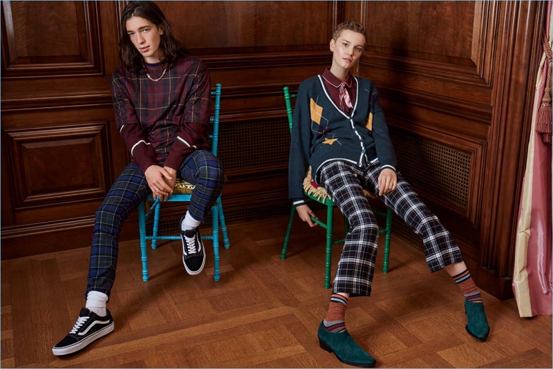 Gabriel Christensen and Lina Hoss embrace the plaid trend. Mixing patterns, Gabriel wears a DJAB tartan longline t-shirt and pants with a striped sweater.
