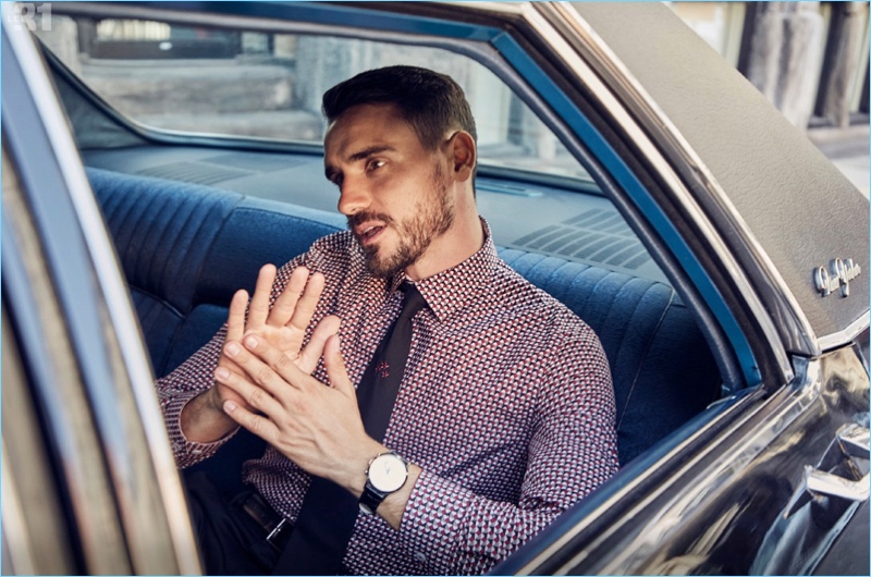 Model Arthur Kulkov sports a LE 31 geometric print shirt and embroidered tie with a Skagen watch.