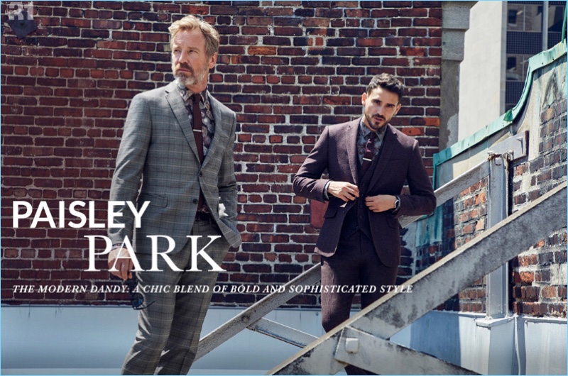 Models Rainer Andreesen and Arthur Kulkov showcase paisley print fashions from Simons. Pictured left, Rainer sports a LE 31 floral sketch shirt and colored tie with a Bosco Prince of Wales suit. Meanwhile, Arthur wears a LE 31 plum three-piece suit with a peony shirt.