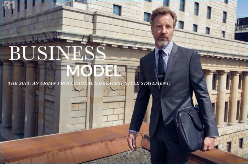 Tackling classic business style, Rainer Andreesen wears a LE 31 grey-blue Prince of Wales suit, floral stripe shirt, and knit tie.