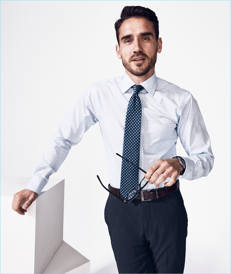 Arthur Kulkov dons a dress shirt, tie, and trousers for Style Bureau.