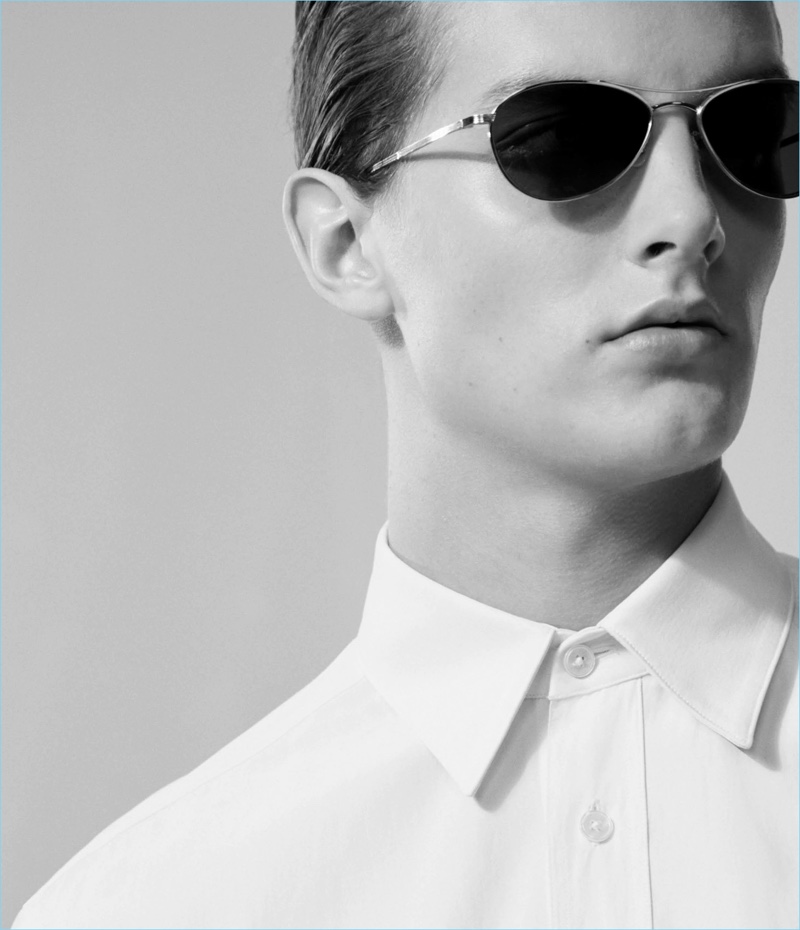 Model Kajus Valciukas sports a boxy white shirt from The Row.