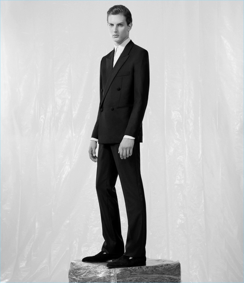 A sleek vision, Kajus Valciukas models a slim-fit tailored suit from The Row.