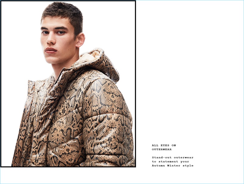 Making a statement, Finn Hayton wears a reptile print puffer jacket from Topman.