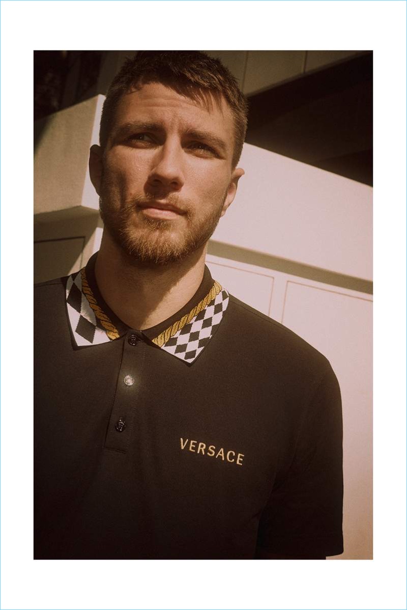 Andrew Pozzi wears a Versace cotton-piqué polo shirt.