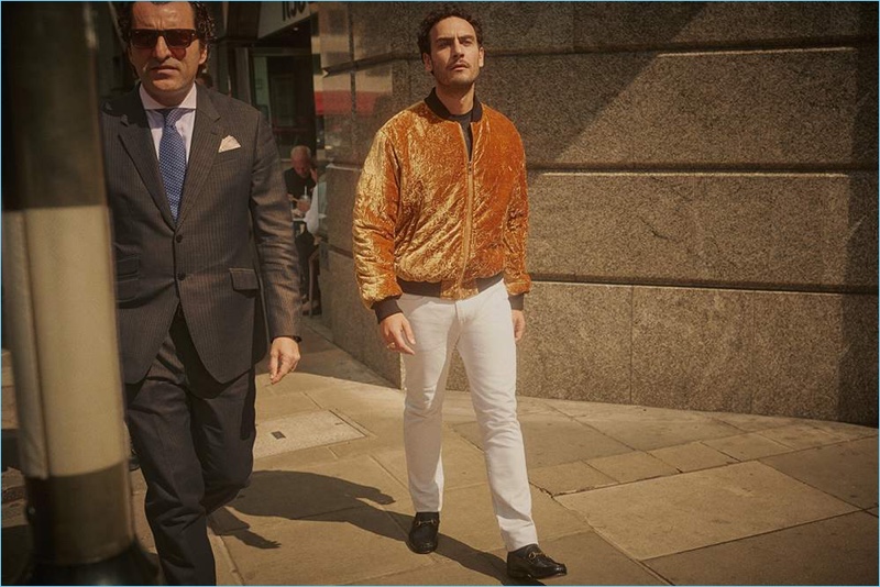 Sporting a Versace velvet bomber jacket, Cesare Taurasi also wears a James Perse t-shirt, Burberry jeans, and Gucci loafers.