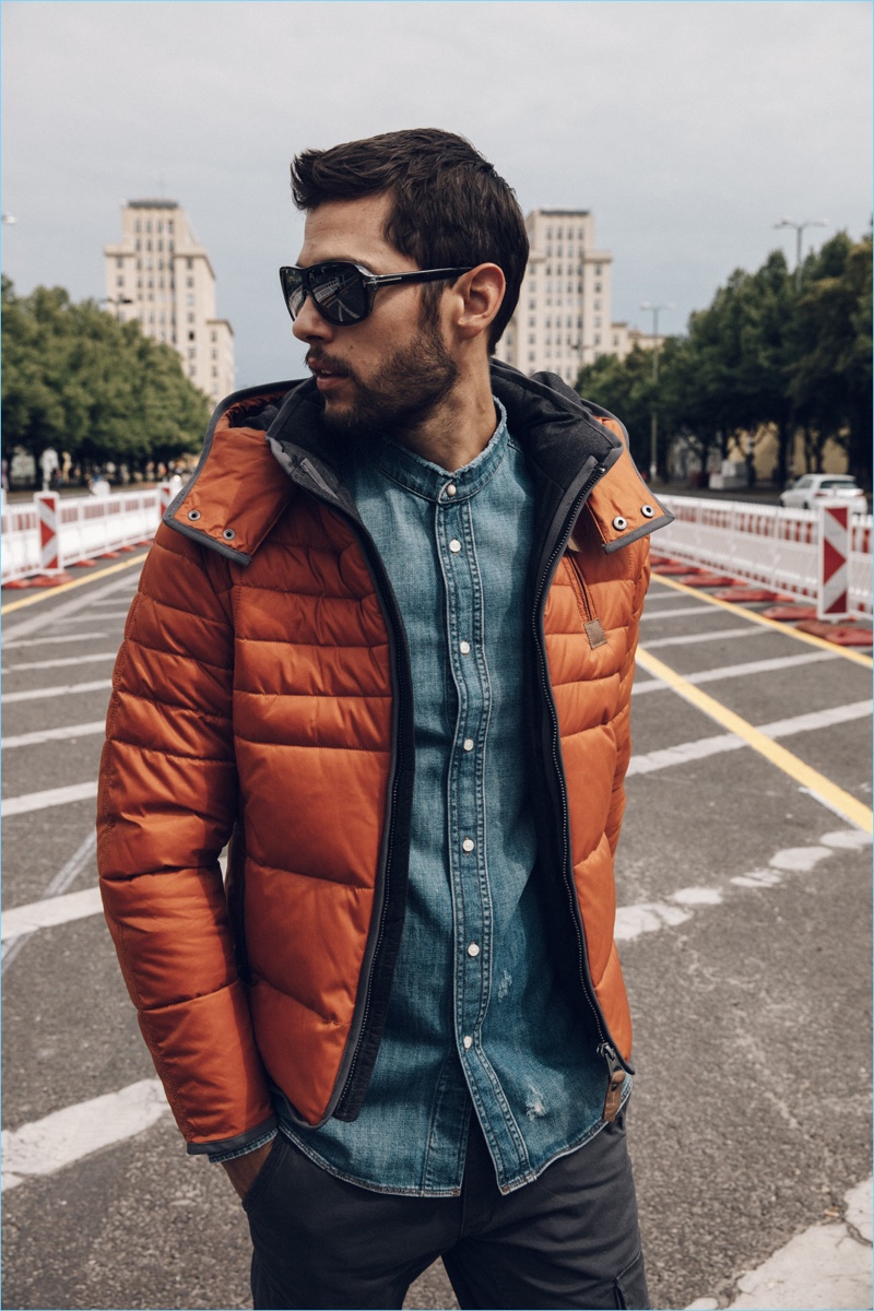 Stepping out, René Grincourt wears a Nagano jacket, Jack & Jones pants, and a Drykorn denim shirt.