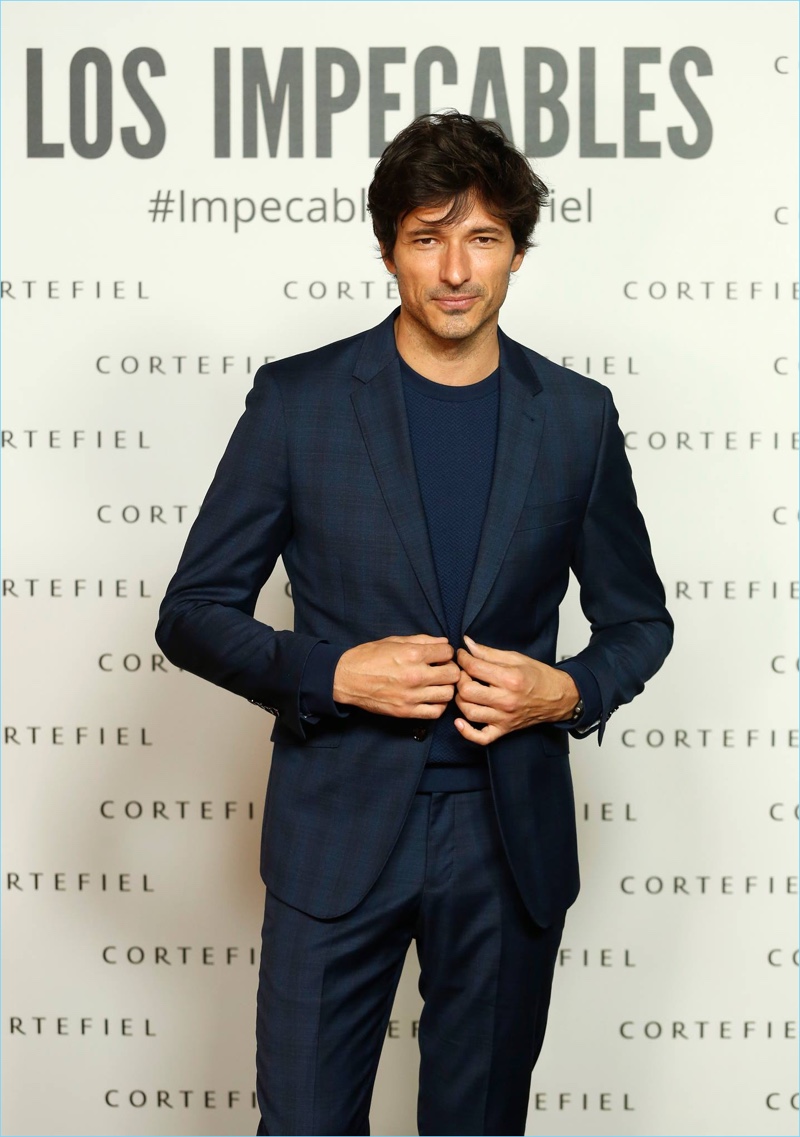 Promoting his new campaign with Cortefiel, Andres Velencoso hits the step and repeat.