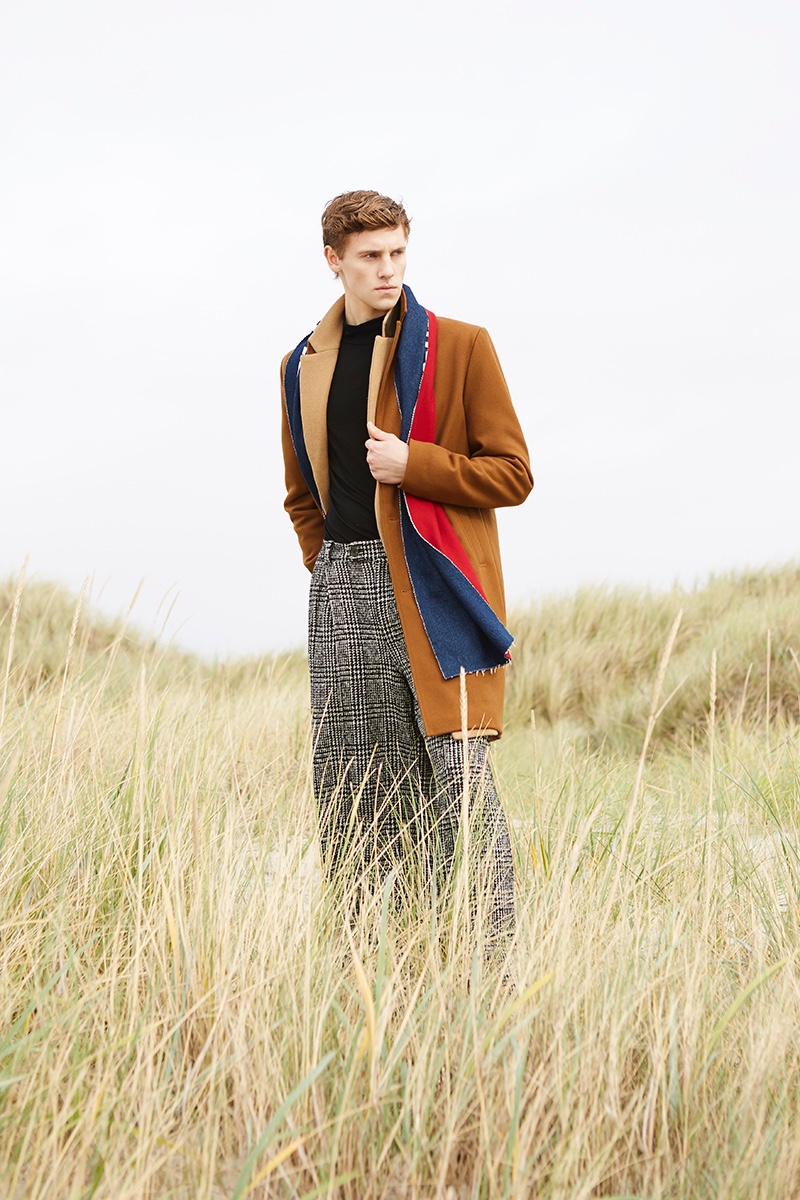 Anton wears scarf Damur, brown coat Samsøe & Samsøe, camel coat Reserved, turtleneck UNIQLO, and pants Fomme.