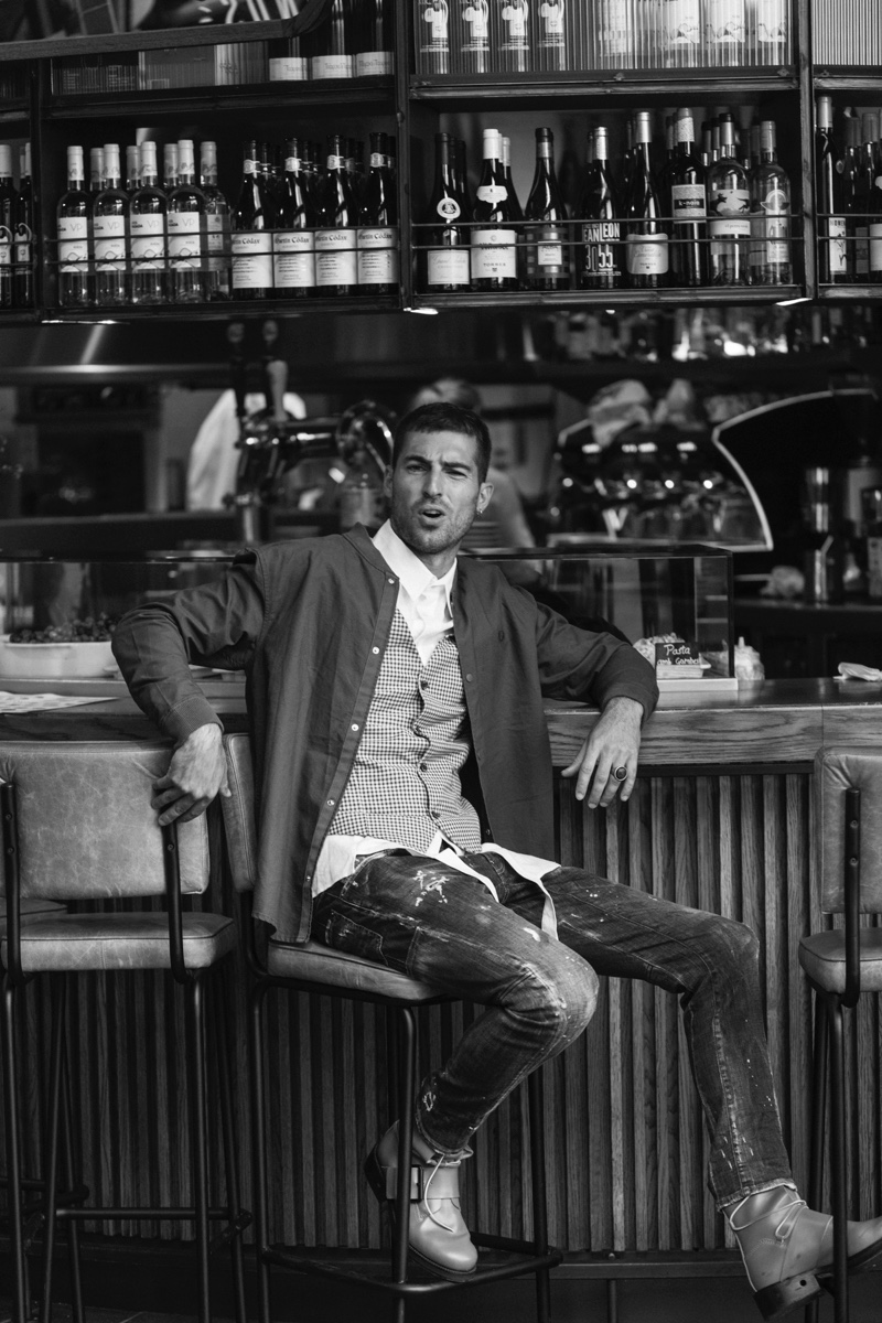 Antonio wears jacket Fred Perry, vest Galo Denim, shirt Llamazares y de Delgado, ring Galapagos, boots Dirk Bikkembergs, and jeans Dsquared2.