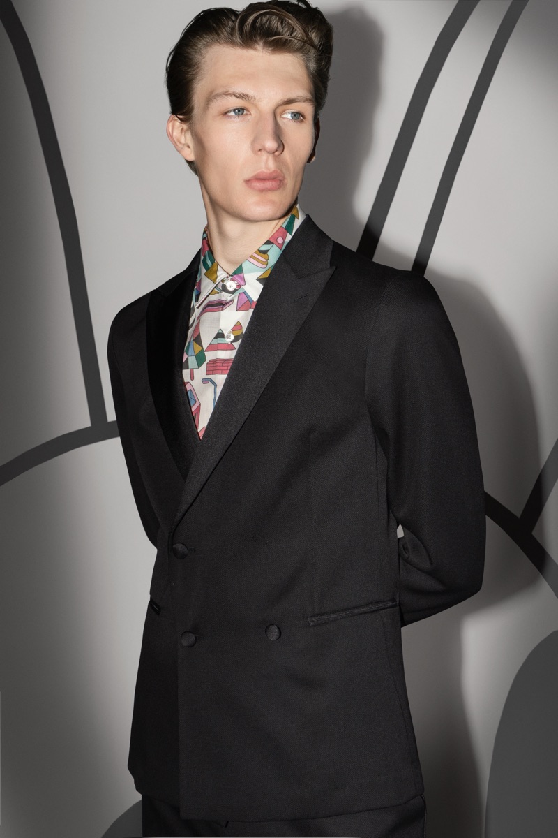 Finnlay Davis dons a sharp suit with a graphic shirt from the BOSS x Jeremyville holiday collection.