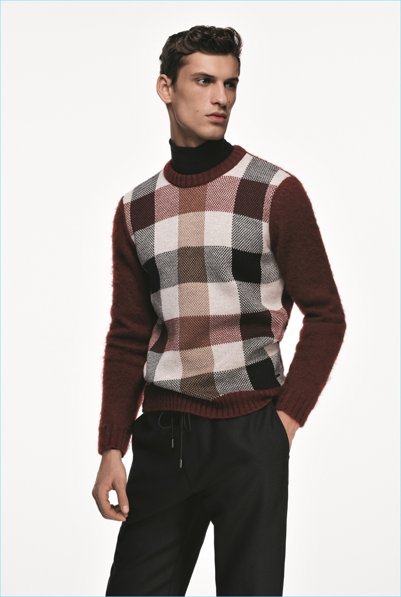 David Trulik models a check sweater from the BOSS Made in Germany capsule collection.