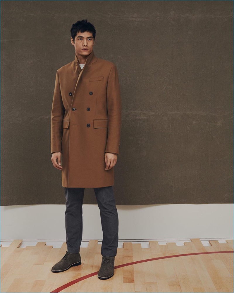 Hao Yun Xiang dons a Banana Republic x Kevin Love double-breasted coat and slim-fit Traveler pants.