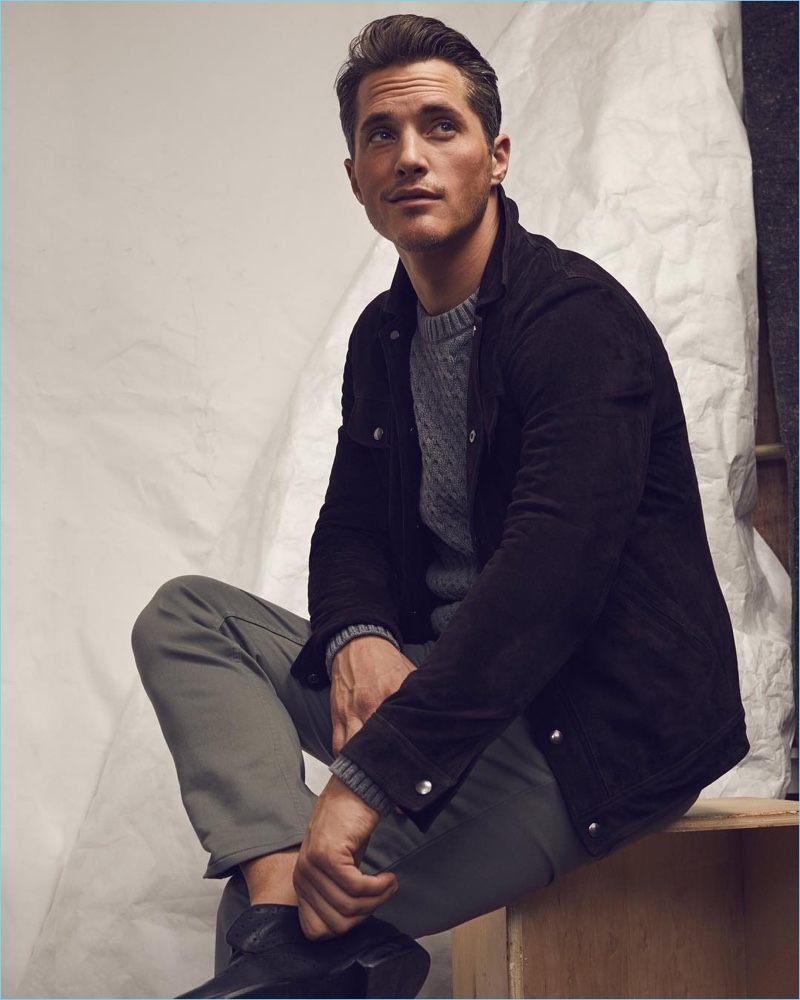 British model Ollie Edwards plays it smart in a Banana Republic Italian moleskin jacket, cable-knit sweater, and tapered traveler utility pants.