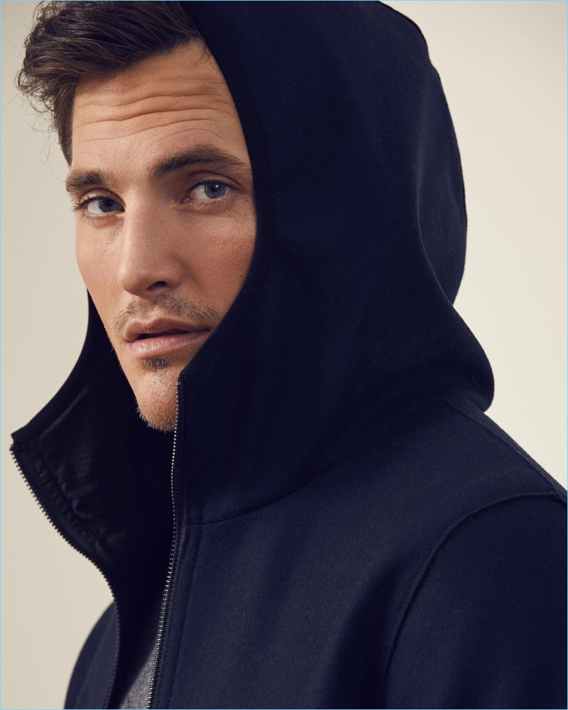 Ollie Edwards dons an Italian wool-blend knit hooded jacket by Banana Republic.