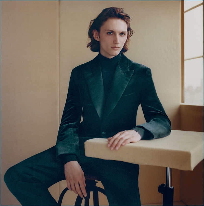 Henry Rausch dons a velvet tuxedo jacket and a wool-blend turtleneck sweater by Brioni.