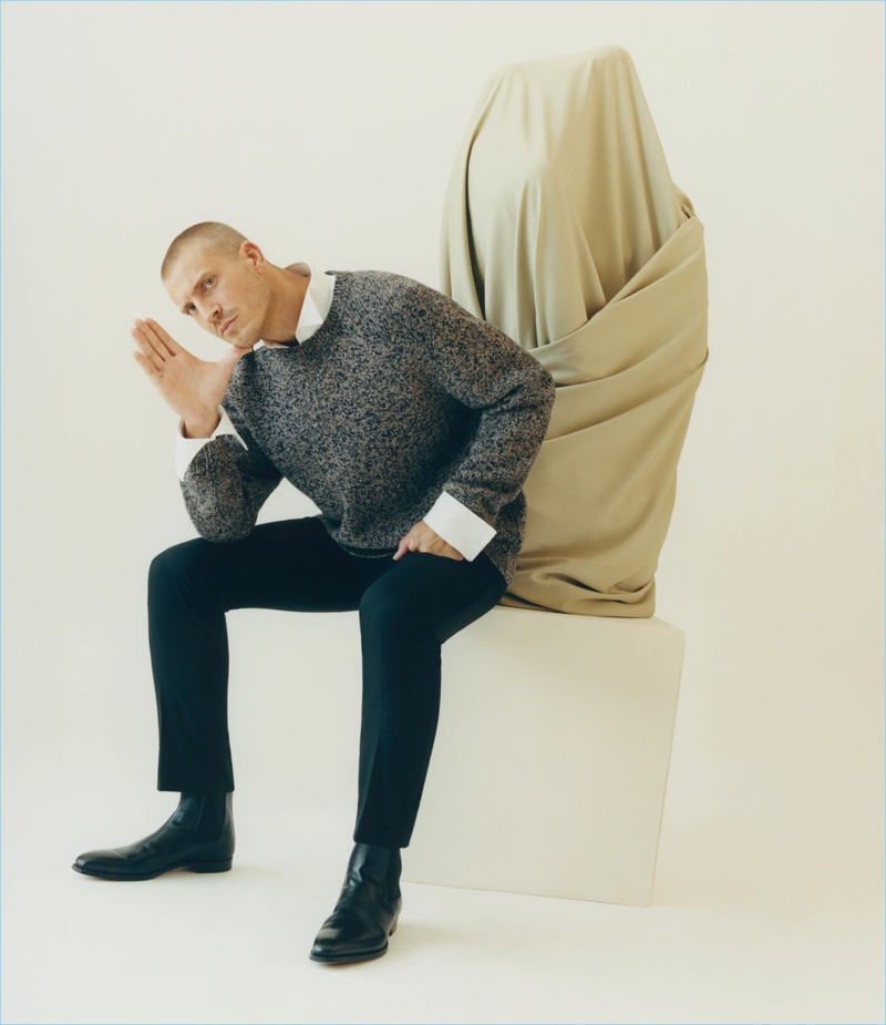 Connecting with Barneys, Mike Guenther wears a Brioni mélange wool chunky sweater and wool flat-front trousers with Crockett & Jones Chelsea boots.