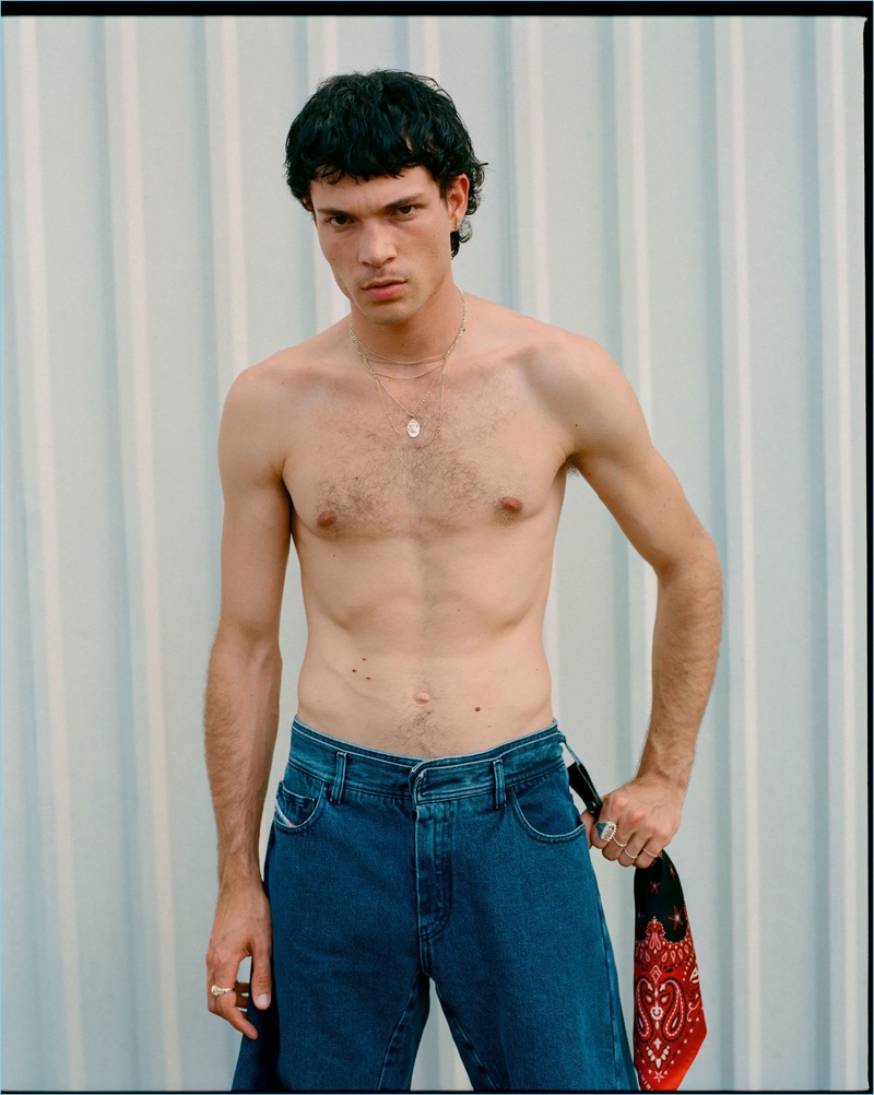 French model Luka Isaac rocks Diesel Red Tag jeans and an AMIRI keyring.