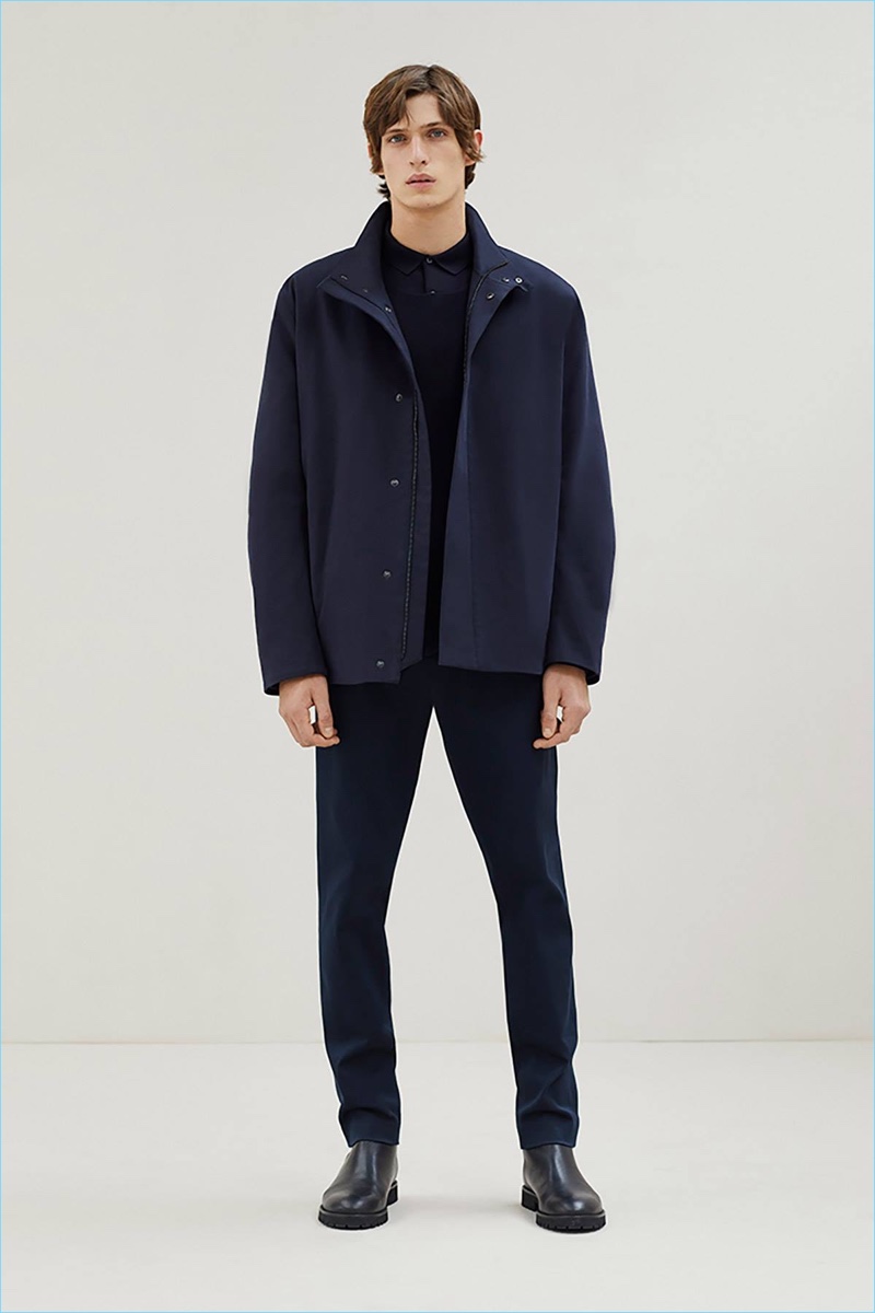 Front and center, Edoardo Sebastianelli rocks a navy look from COS.