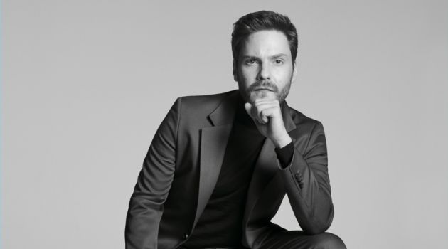 Daniel Brühl Connects with BOSS for Made in Germany Capsule Campaign Donning a sharply tailored suit, Daniel Brühl fronts the BOSS Made in Germany capsule collection campaign.