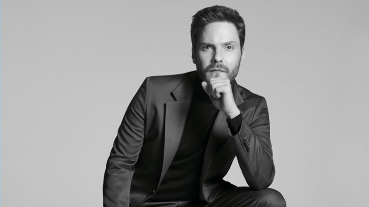 Donning a sharply tailored suit, Daniel Brühl fronts the BOSS Made in Germany capsule collection campaign.