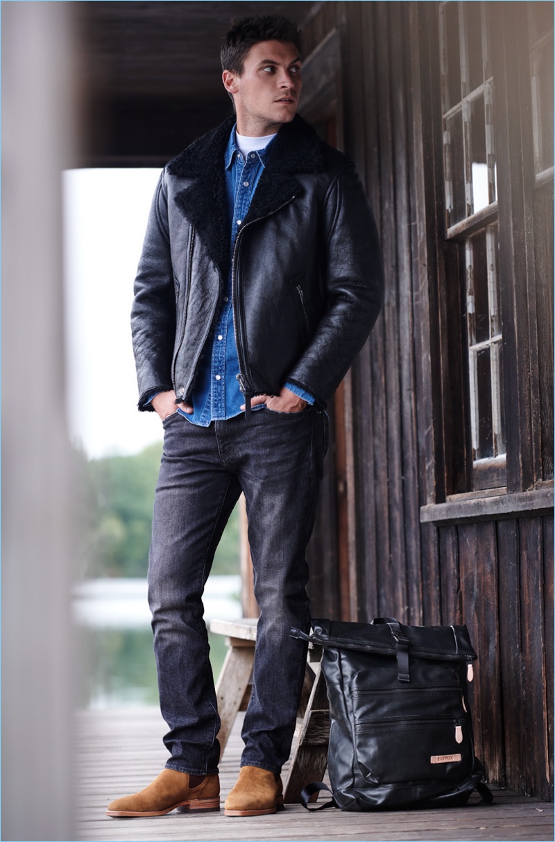 Layer Better: Miles Garber wears a Coach 1941 western shirt and shearling moto jacket. He also sports a Theory mock tee, Levi's Red Tab 511 slim jeans, and an Eastpak Jacker backpack.