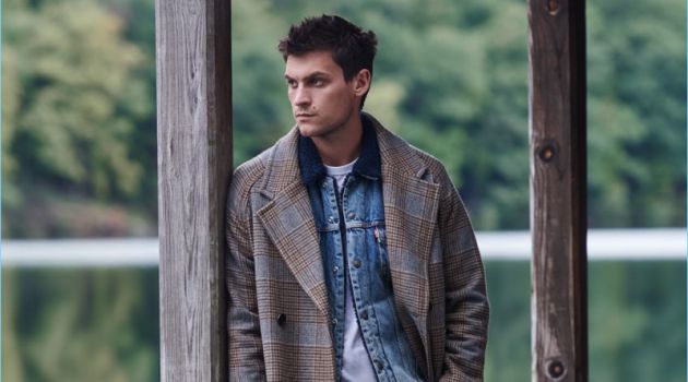 Miles Garber Layers in Fall Essentials for East Dane Double Up: Miles Garber rocks a Billy Reid overcoat, Levi's Red Tab sherpa trucker jacket, Fred Perry ringer t-shirt, Ted Baker trousers, and Clarks Wallace suede boots.