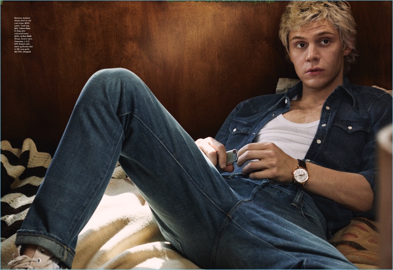 Doubling down on denim, Evan Peters wears a Levi's western denim shirt. Peters also rocks a Calvin Klein tank, G-Star Raw jeans, and Converse shoes.