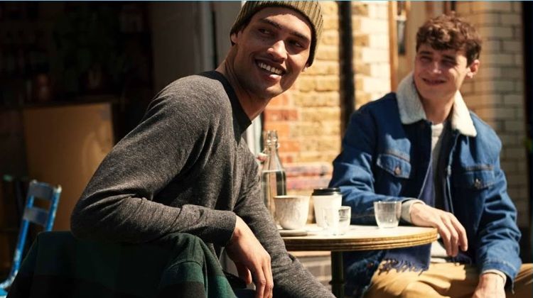 Left: All smiles, Cameron Gentry wears a H&M raglan-sleeved sweater and jeans. Right: Adrien Sahores wears a denim trucker jacket and joggers.