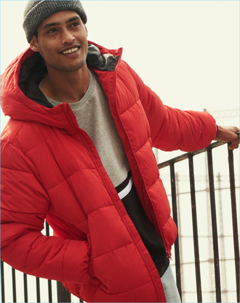 Cameron Gentry rocks a red padded jacket from H&M.