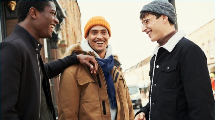 All smiles, Hamid Onifade, Cameron Gentry, and Adrien Sahores don winter outerwear from H&M.