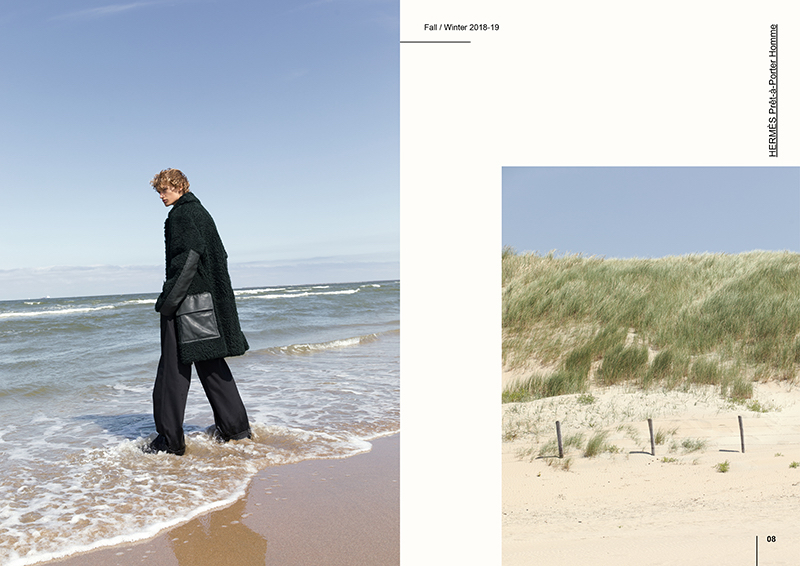 Donning a statement coat from Hermès, Mats Engel takes to the beach.