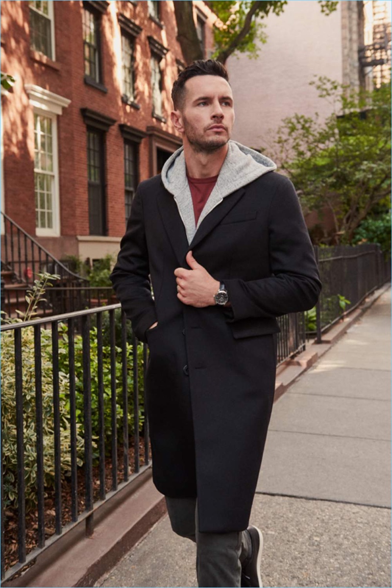 Going for a stroll, JJ Redick dons a Baume & Mercier watch, Acne Studios coat, Mr P. hoodie, Sunspel t-shirt, Common Projects sneakers, and NN07 trousers.