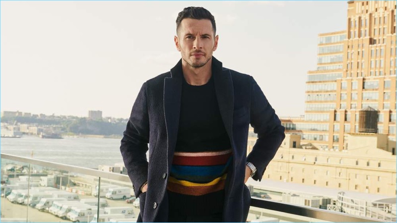 JJ Redick wears a Brioni overcoat, Prada sweater, and Officine Generale trousers with a Vacheron Constantin watch.