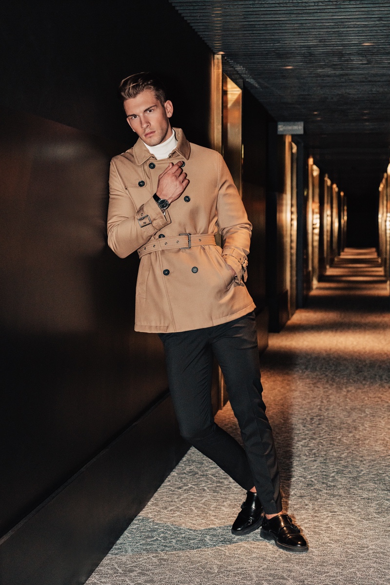 Jake wears trench Burberry, turtleneck Reserved, pants Dior Homme, and shoes Topman.