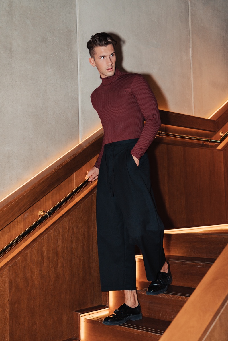 Jake wears turtleneck Reserved and pants Y-3.