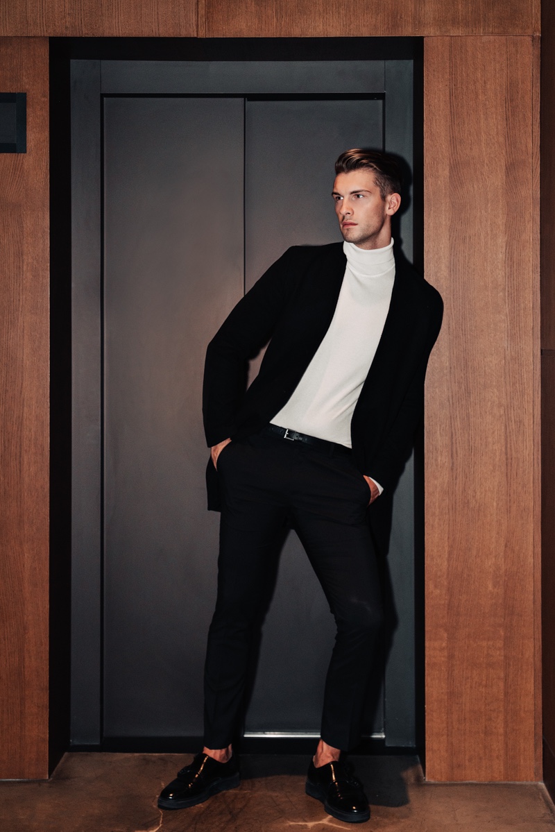 Jake wears jacket Theory, turtleneck Reserved, pants Gucci, and belt ASOS.