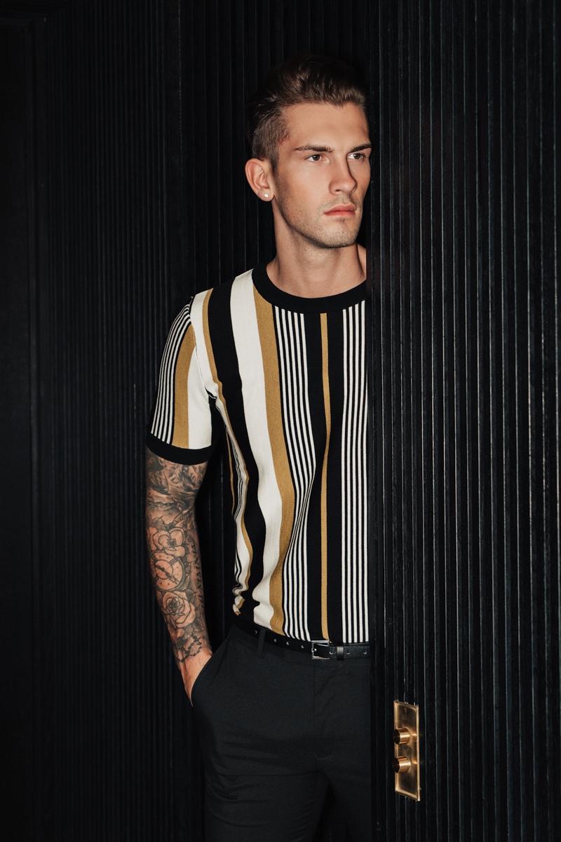 Jake wears striped t-shirt Topman and pants Dior Homme.