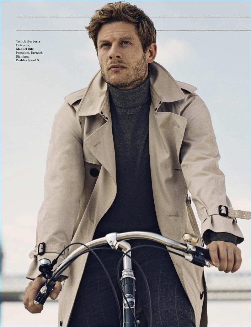 James Norton dons a Burberry trench with a Manuel Ritz turtleneck and Berwich trousers.