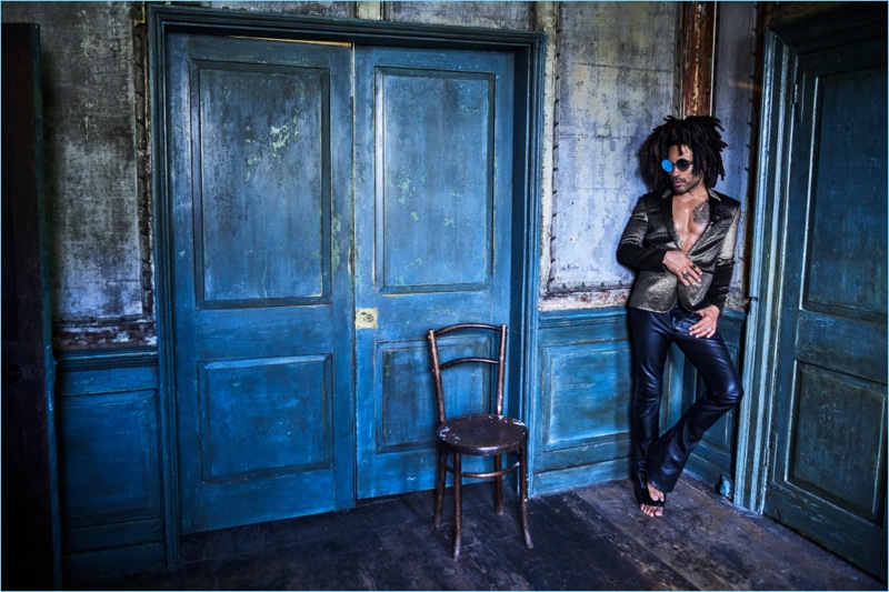 A cool vision, Lenny Kravitz dons a Saint Laurent jacket with his own leather pants and sunglasses.