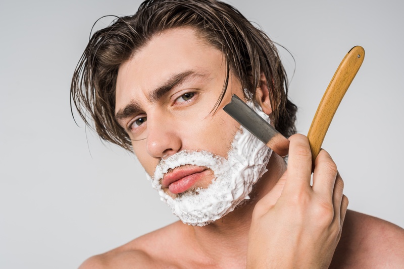 Man Shaving with Straight Razor