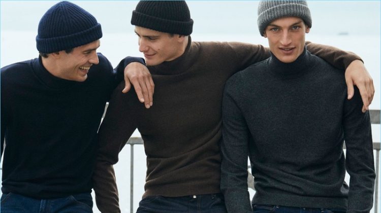 Models Arthur Gosse, Ben Allen, and Aaron Shandel don knit beanies and wool/cashmere turtleneck sweaters by Massimo Dutti.