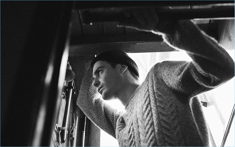 Ben Allen dons a cable-knit sweater and knit beanie from Massimo Dutti.