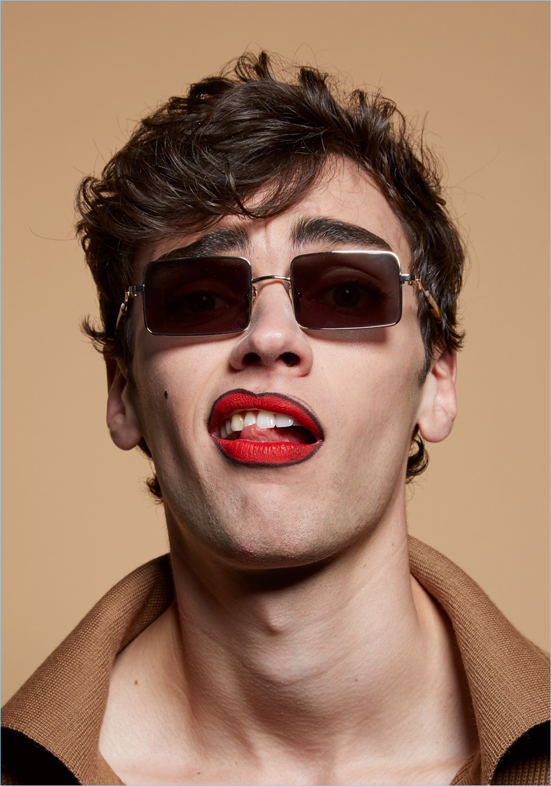 Model Xander Weber sports Monumental by Karen Walker Ali Gold sunglasses.