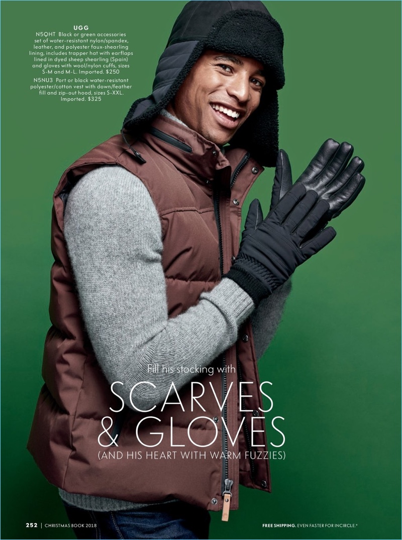 All smiles, Malik Lindo sports a UGG gloves and a hood.