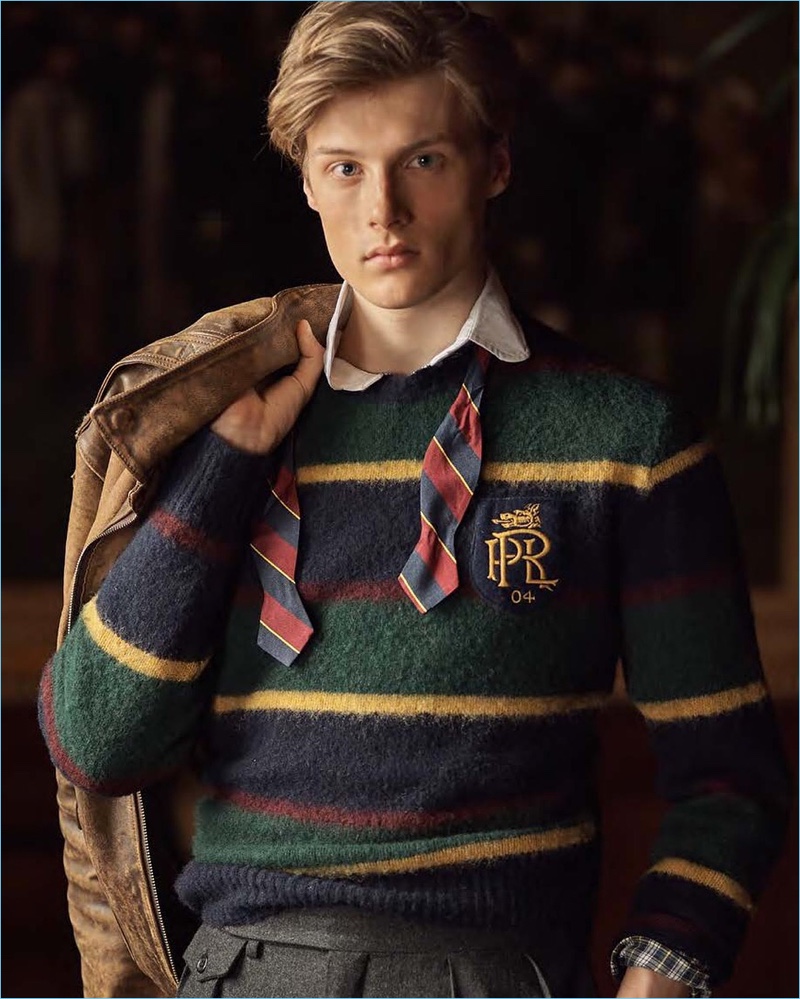 Hugh Laughton-Scott dons a striped sweater, polo, and bow-tie from POLO Ralph Lauren.