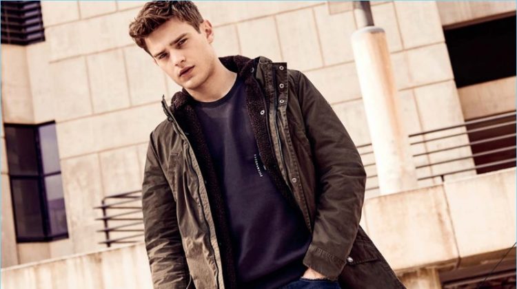 Sporting a parka, Bo Develius appears in Q/S designed by s.Oliver's fall-winter 2018 campaign.