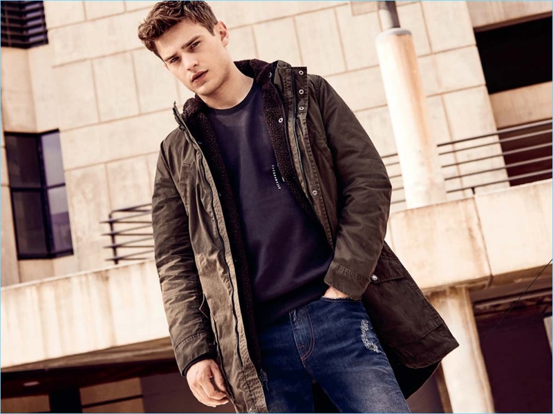 Sporting a parka, Bo Develius appears in Q/S designed by s.Oliver's fall-winter 2018 campaign.