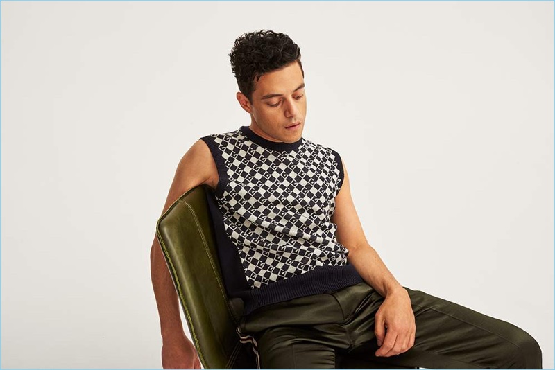 Starring in a Mr Porter shoot, Rami Malek sports a Gucci sweater vest and satin drawstring trousers.